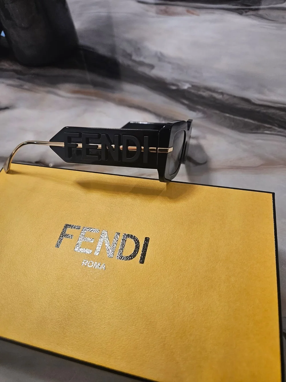 Fendi Black Sunglasses with Gold Temples and Dark Lenses